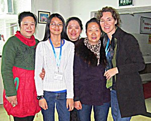 My oldest daughter with the aunties who cared for her as a baby (on both sides of her), the orphanage director who also cared for her, and me, during our visit . 